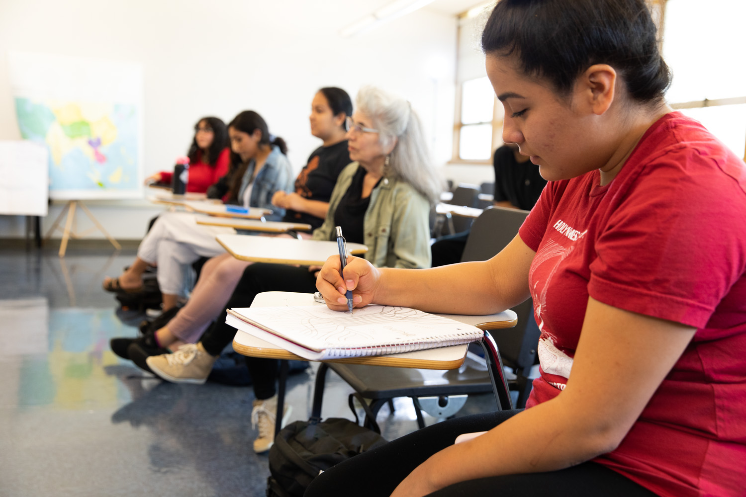 Holy Names University students sitting at desks in a classroom