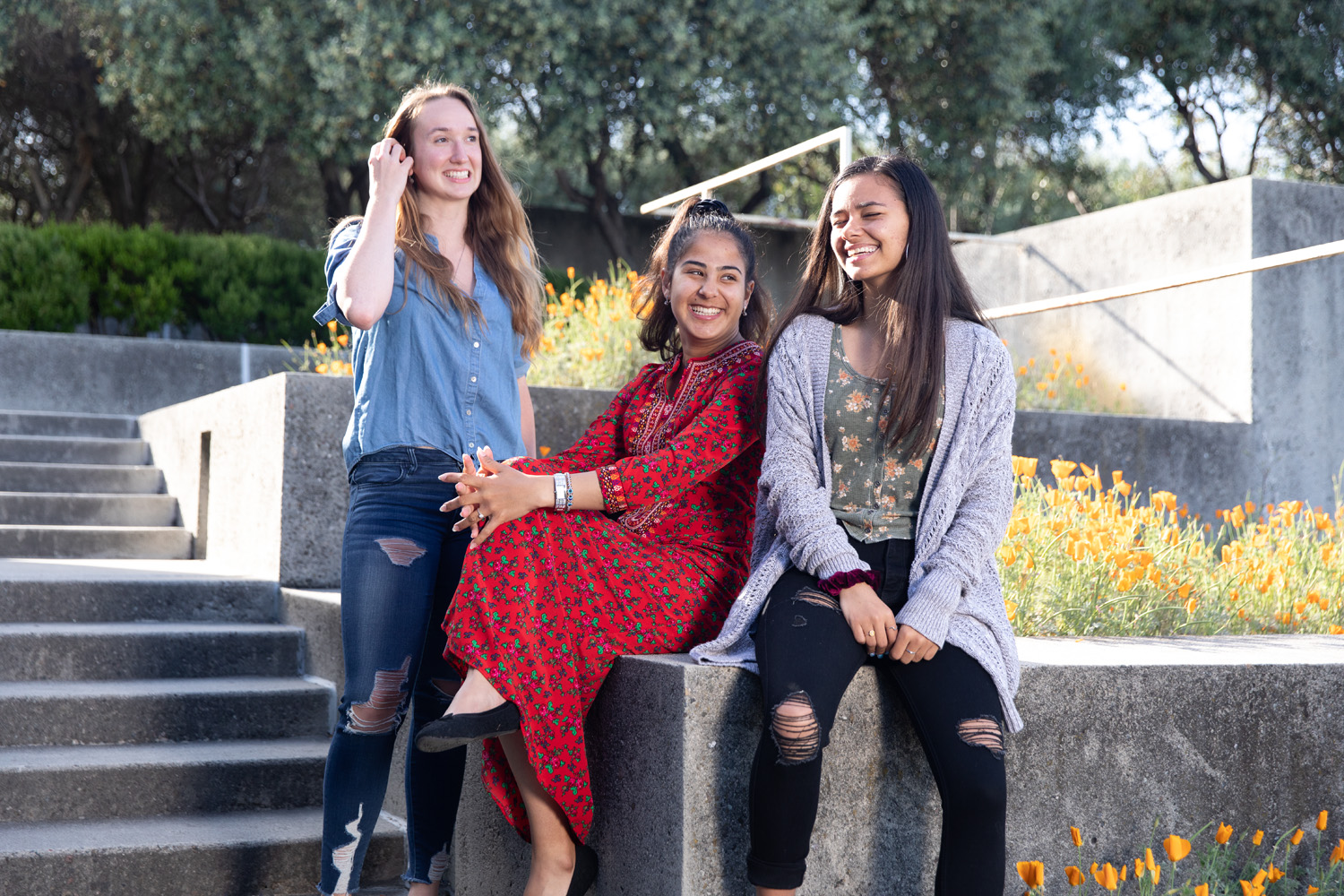 Holy Names University students sitting together on campus