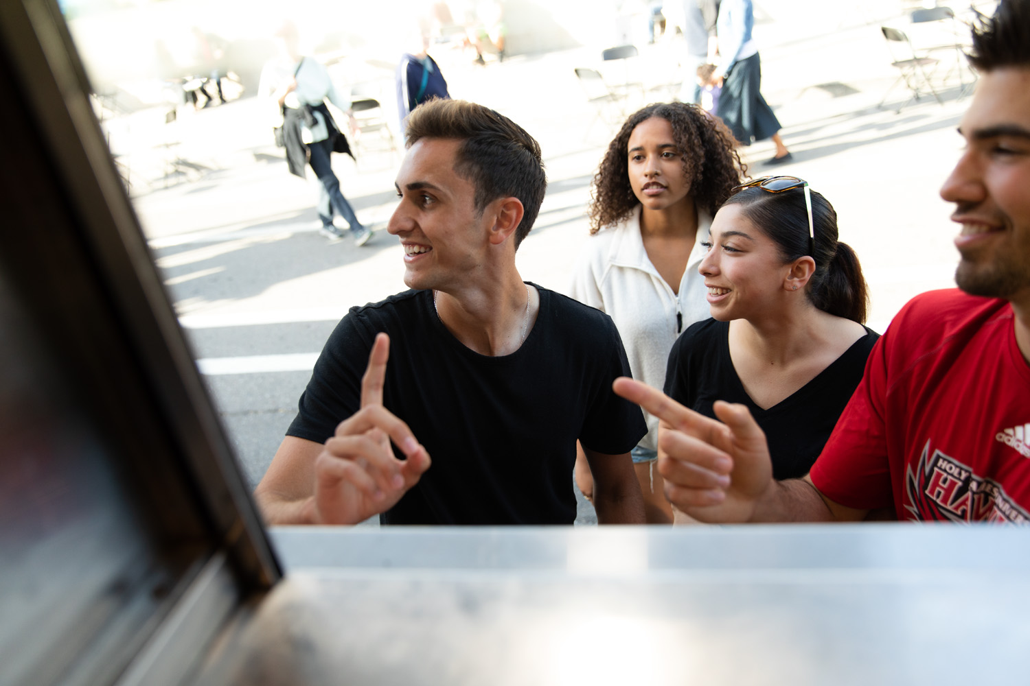 Four Holy Names University students smiling
