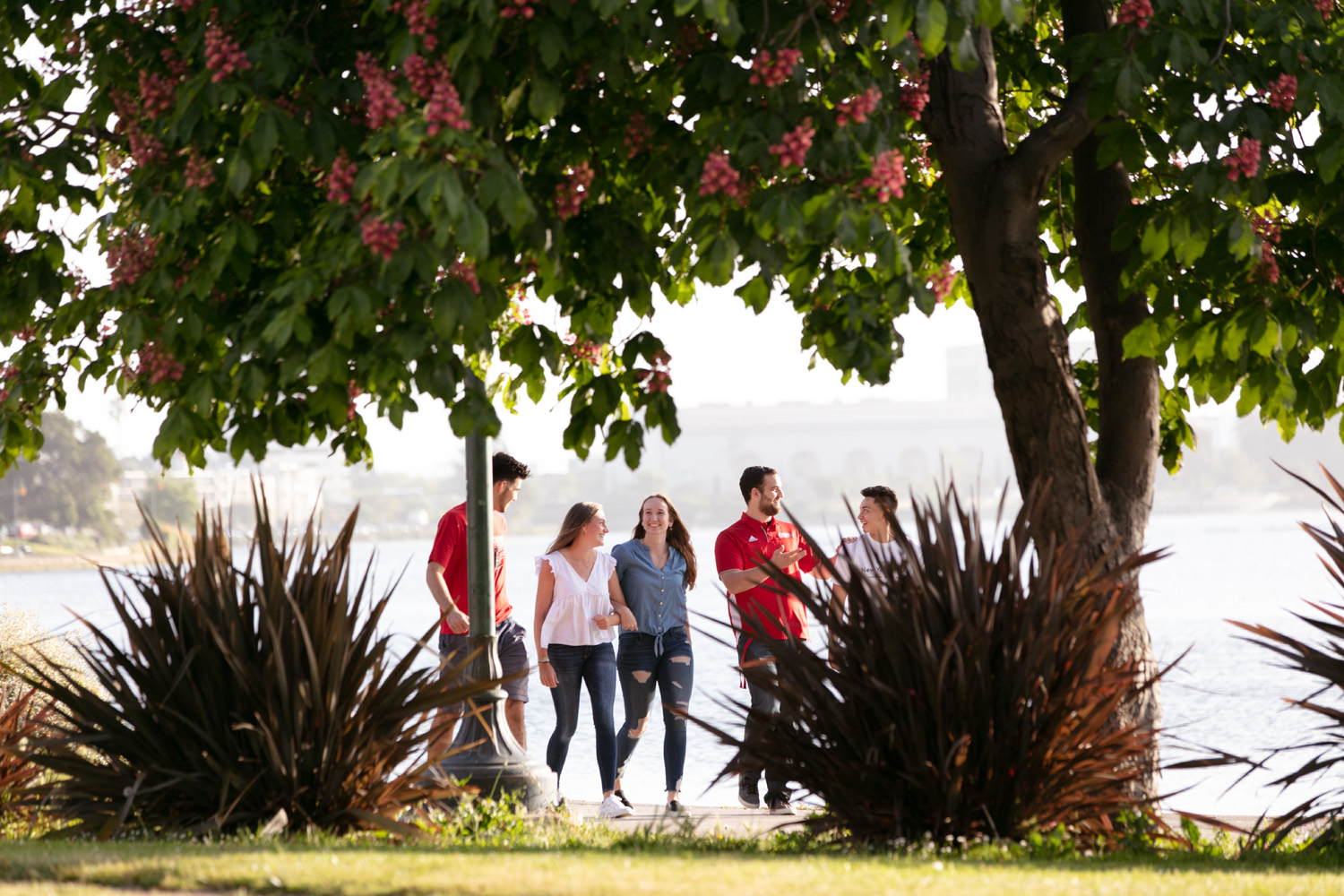 Holy Names University first-year students walking alongside the river in Oakland, California