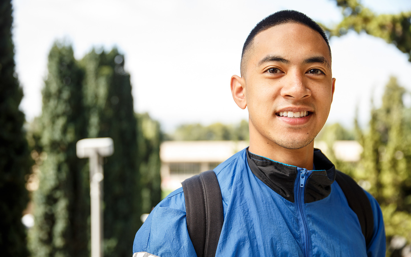 Holy Name University MBA student on campus steps