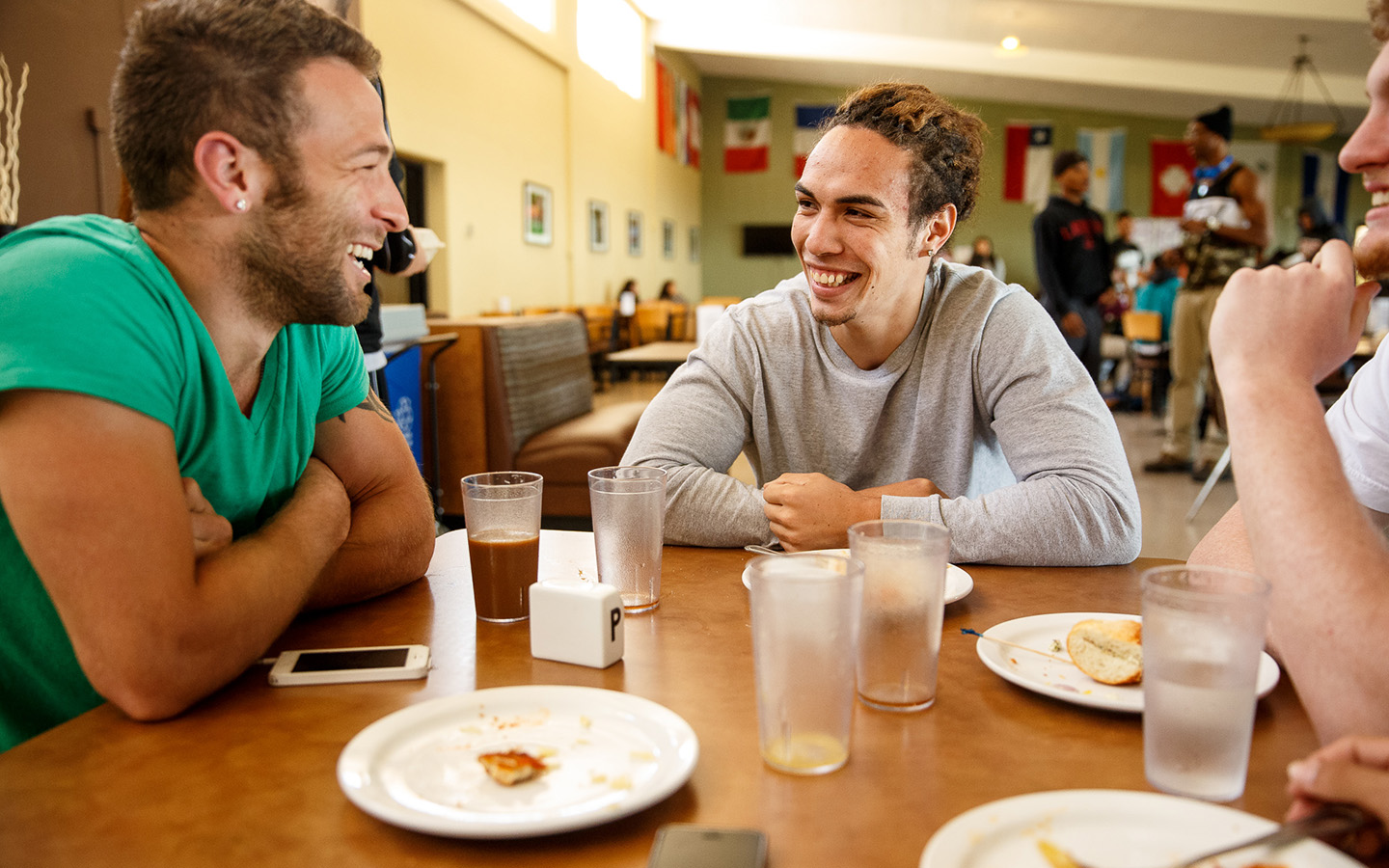 Two Holy Name University students laughing and enjoying lunch