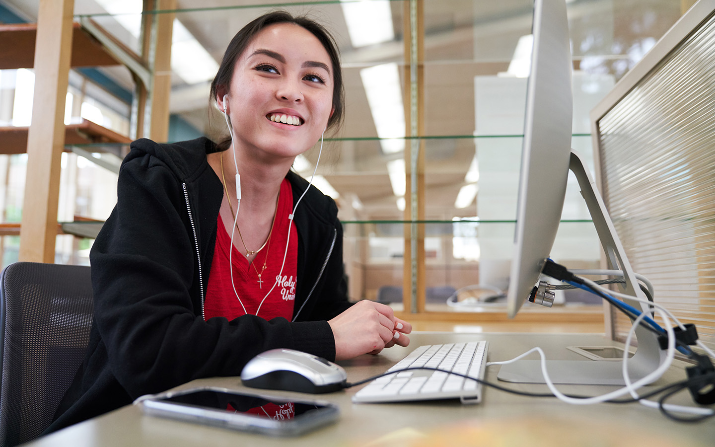student in library