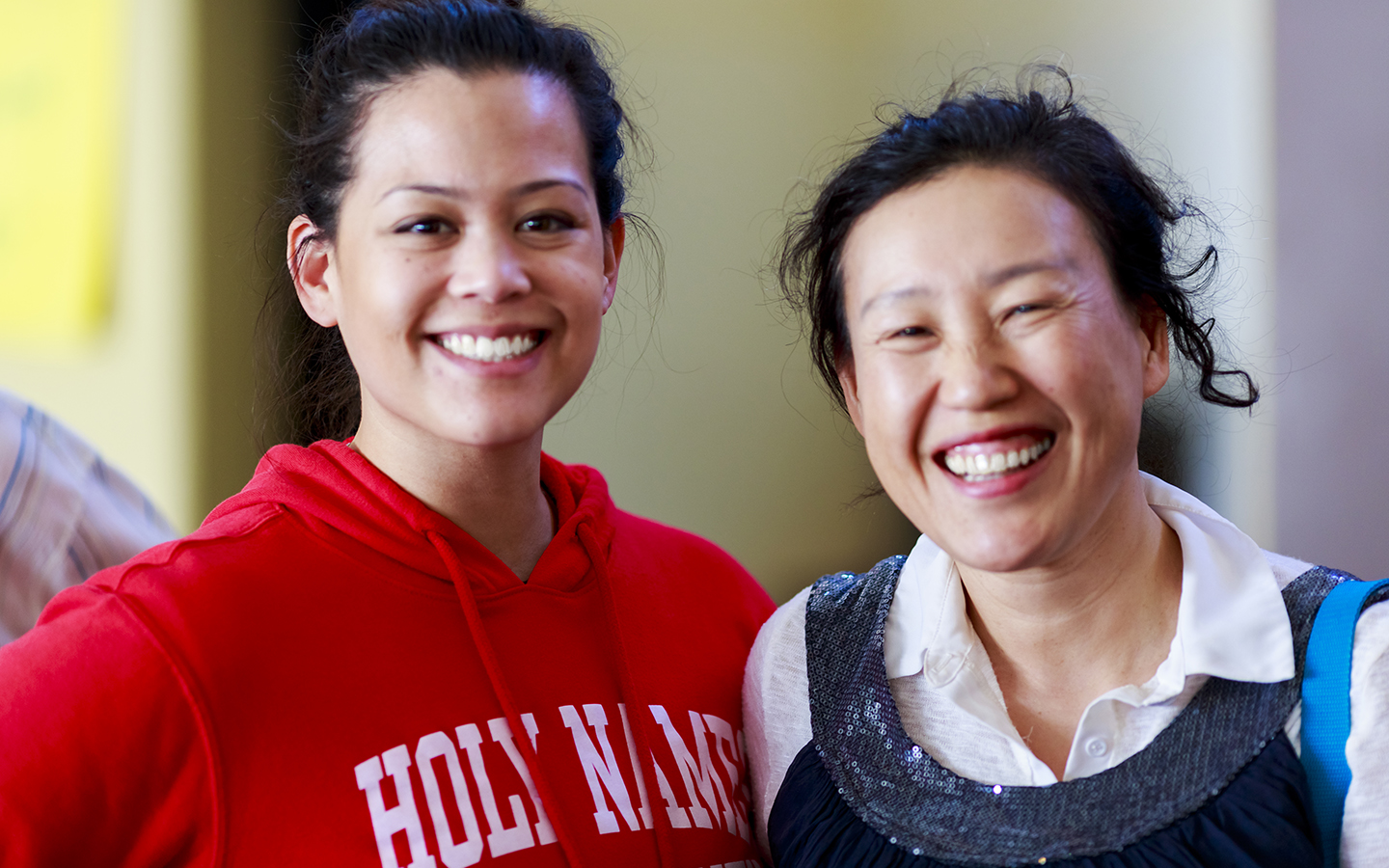 two Holy Names University students smiling