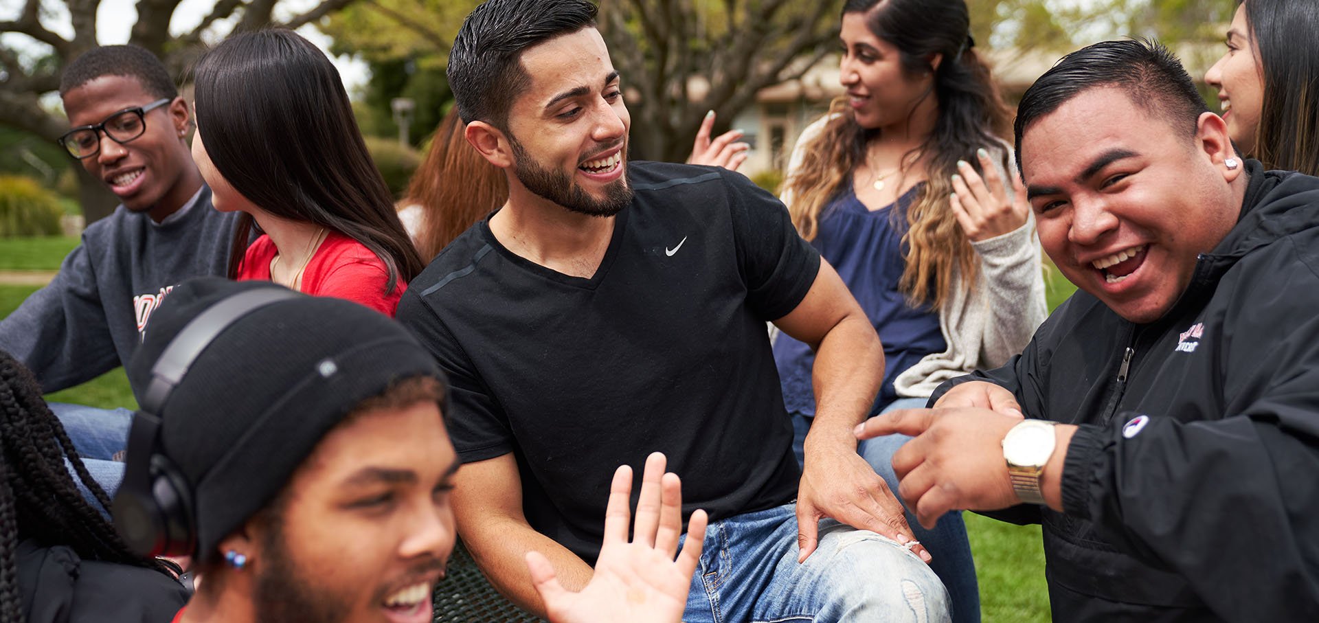 Holy Names University students laughing together on campus