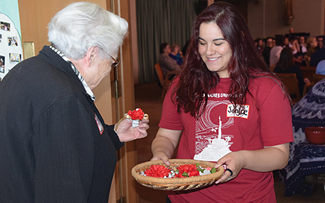 HNU student handing out gifts at Soul Sisters events