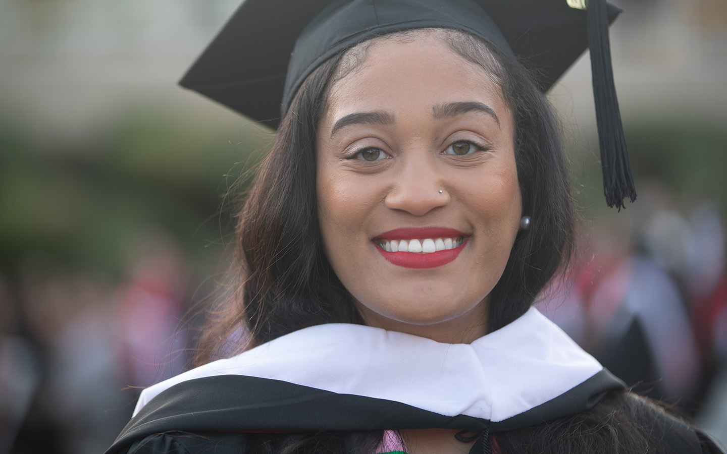 HNU graduate in cap and gown